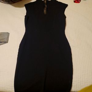 A skin tight black about knee hight dress